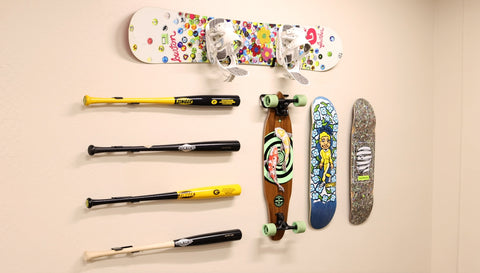 Wall mounted baseball bat, wall mounted snowboard, wall mounted skateboard