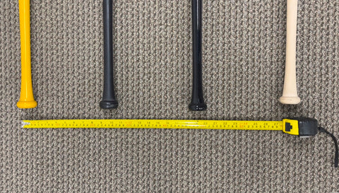 Measuring the space between baseball bats for wall mounting