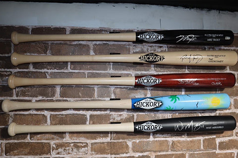 Old Hickory showroom display with signed bats in a HIDEit HBat Mount.