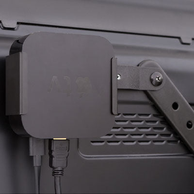 Apple TV mounted to back of wall mounted TV using HIDEit Uni-VESA Adapter Bracket
