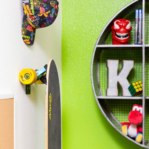 HIDEit Vertical Skateboard Mount sleekly displaying a cruiser board on the wall.