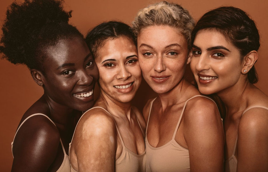 four women with youthful healthy skin