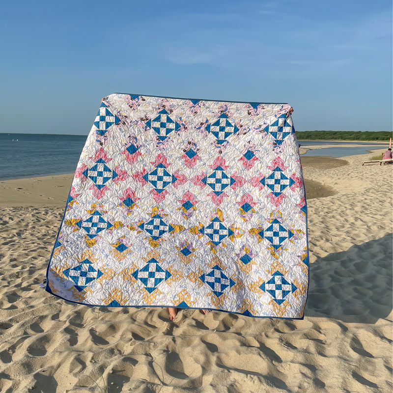 Build your no-waste flying geese, 8-in-1 half-square triangles and quick corner units skills with this free Ocean Gems quilt pattern by The Weekend Quilter for Paintbrush Studio Fabrics featuring Mable Tan Design’s Under the Sea fabric collection. #freequiltpattern 