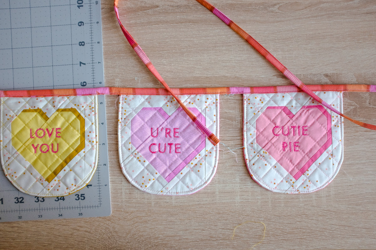Sweet Notes Valentine’s Day heart candy quilted Bunting Tutorial by The Weekend Quilter