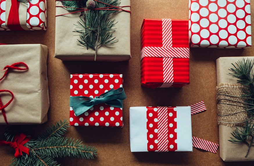 Christmas presents wrapped in all kinds of patterns.