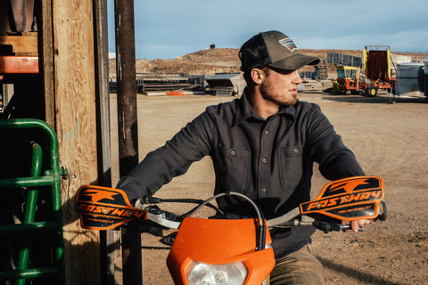 man in sawtooth shirt jacket on a motorcycle