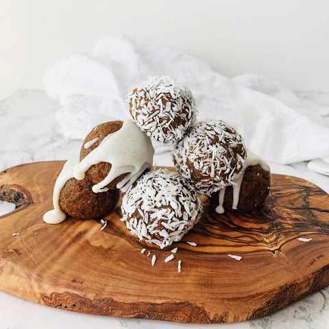 Camu Carrot Cake Bites with coconut powder sprinkled on it