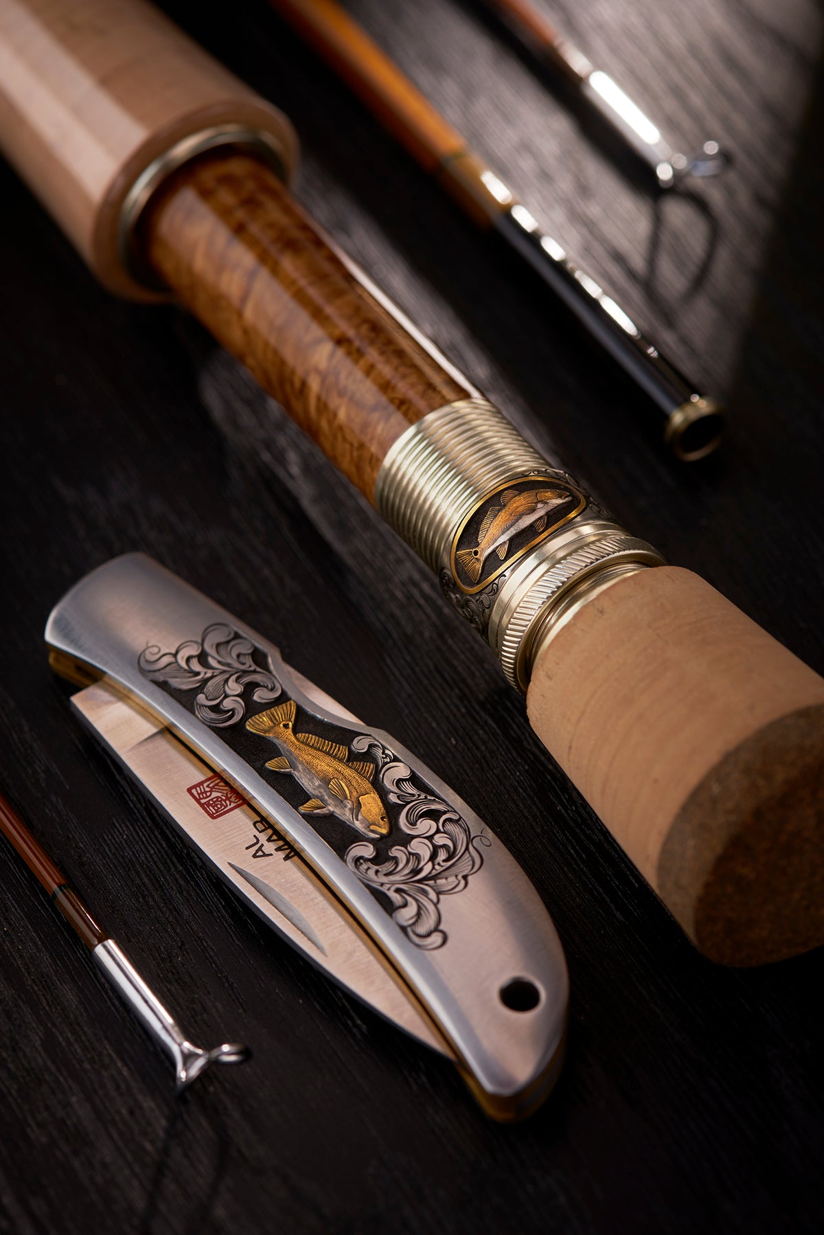 https://cdn.shopify.com/s/files/1/0169/3204/4864/t/3/assets/Hand-engraved-oyster-bamboo-fly-rod-salt-series-tailing-red-fish-by-bill-oyster3_1200x.jpg?v=1622497327