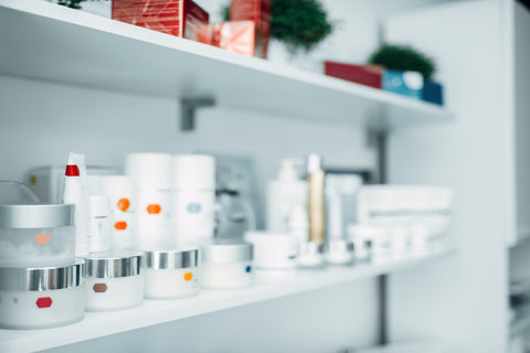 A shelf full of various skincare products