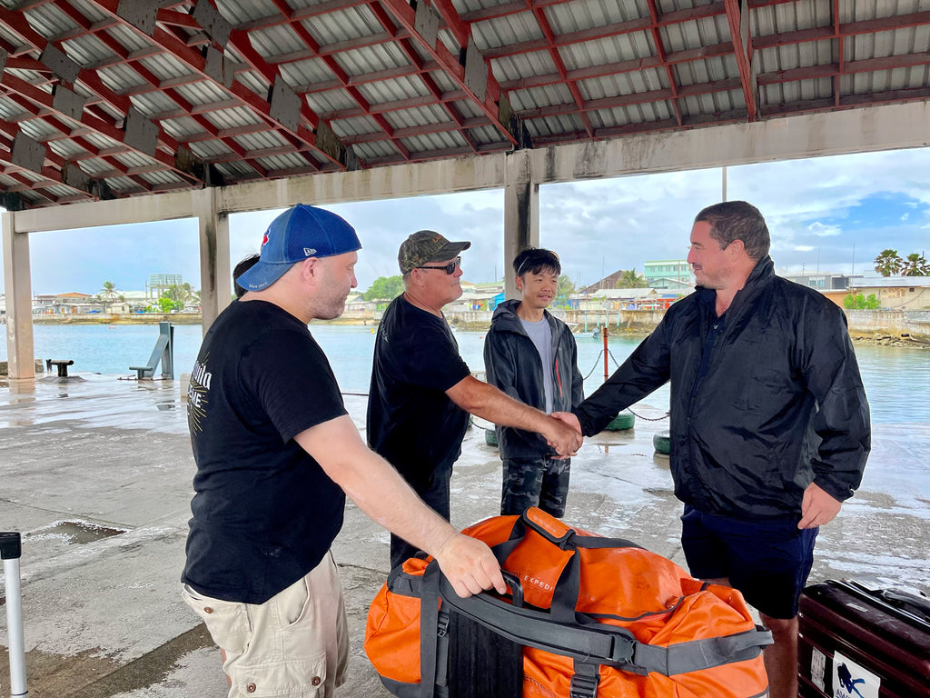 Captain of the Taka Master shaking hands with guests who are leaving Ebeye