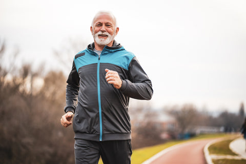photo of older man running outdoors