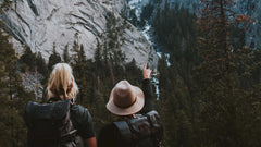 Two hikers pointing at a mountain, showing the nature we protect with our zero waste starter pack