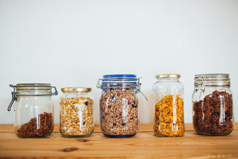 Glass jars holding ingredients for zero-waste storage