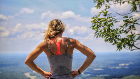 blonde woman overlooking a valley