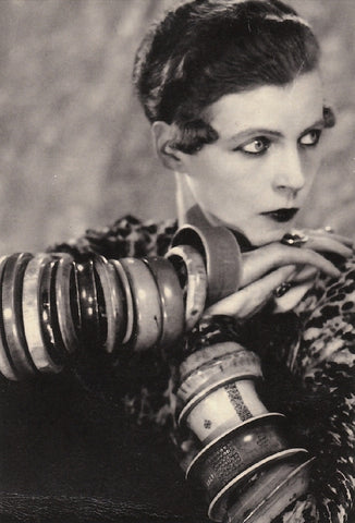 British Writer Nancy Cunard wearing bakelite bangles on both arms