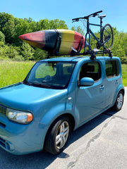 My car with a boat and bike on the roof