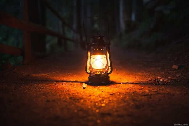 Glowing lantern on a trail