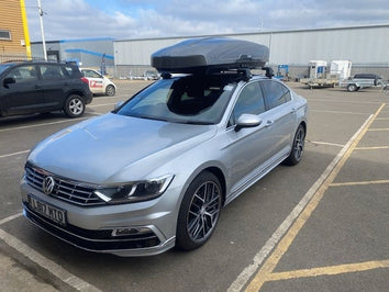 A Thule Motion XT Roof Box fitted to a VW Passat CC
