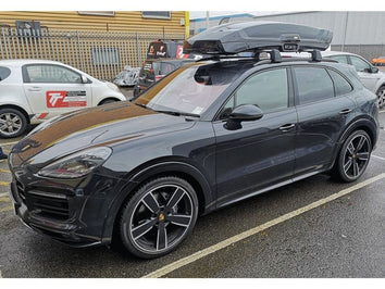 A Thule Vector Roof Box fitted to a Porsche Cayenne