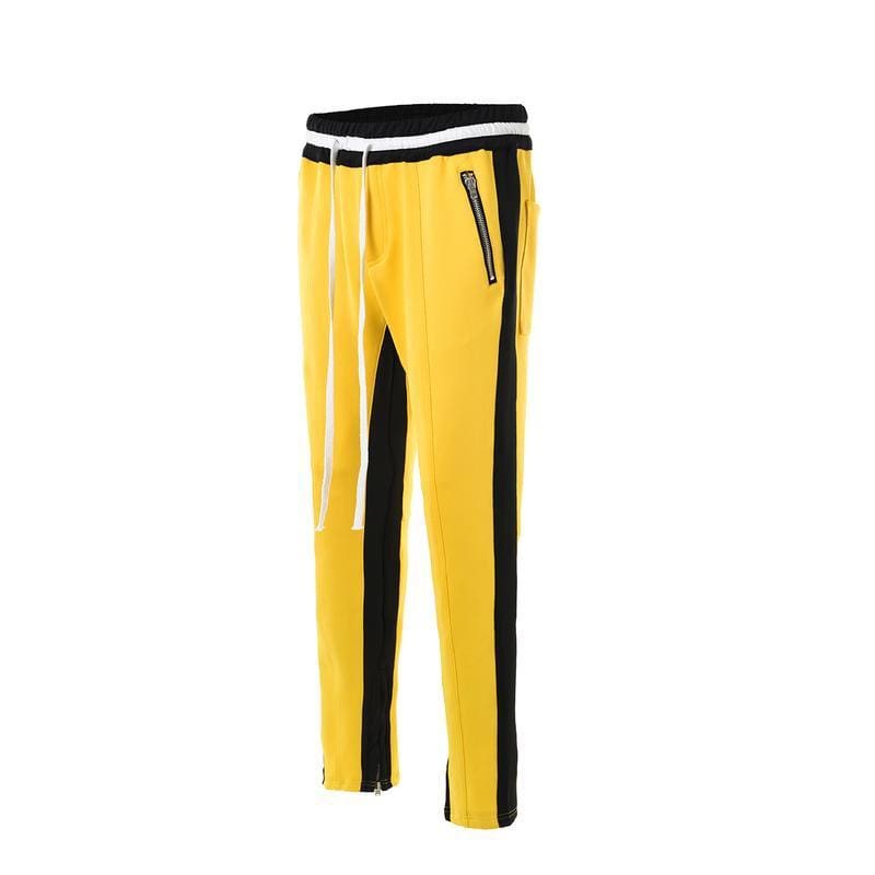 yellow track pants with black stripe