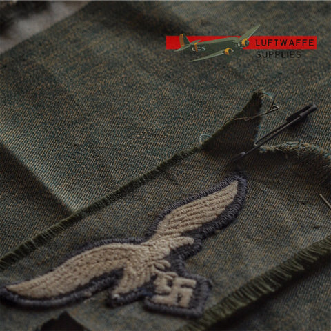 Luftwaffe Supplies grünmeliert fabric next to original fabric.