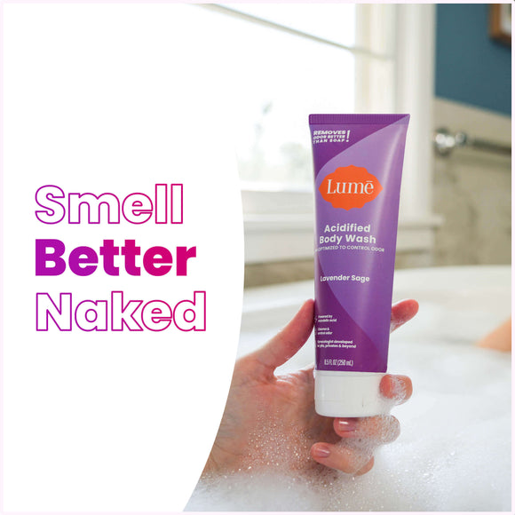 Woman taking a soapy bath holding a Lume lavender sage scented acidified body wash, and the text: smell better naked