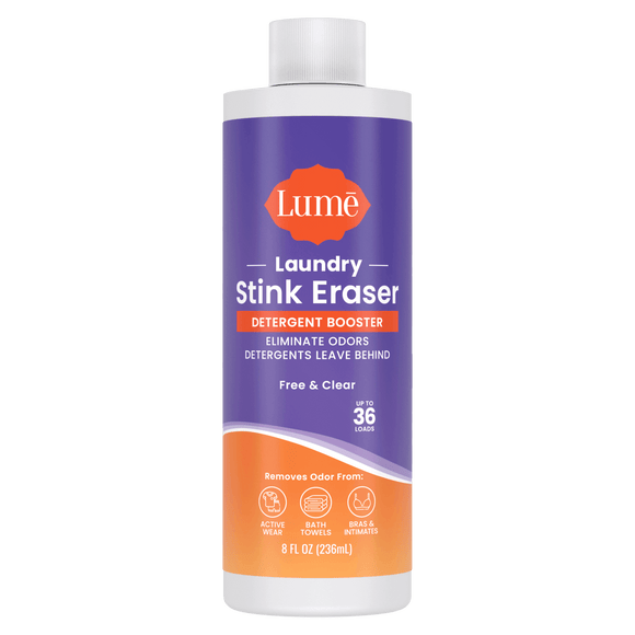 Purple and orange bottle of Laundry Stink Eraser Detergent Booster with the text "Eliminate odors detergents leave behind. Up to thirty six loads." There are three icons indicating it removes odor from activewear, bath towels, and bras and intimates