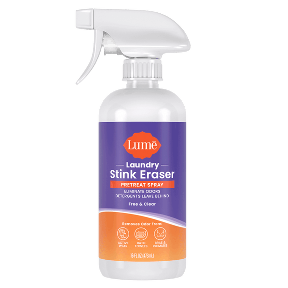 Purple and orange bottle of Laundry Stink Eraser Pretreat Spray with a white spray trigger top. The text on the label reads "eliminate odors detergents leave behind. Free & clear. Removes odor from:" with icons indicating activewear, bath towels, and bras and intimates.