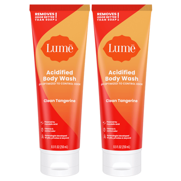 Two orange tubes of acidified body wash in the scent Clean Tangerine