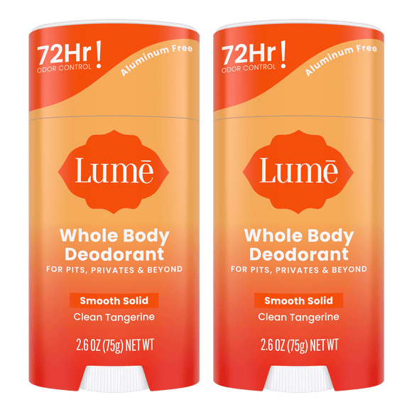 Two orange sticks of solid deodorant in the Clean Tangerine scent