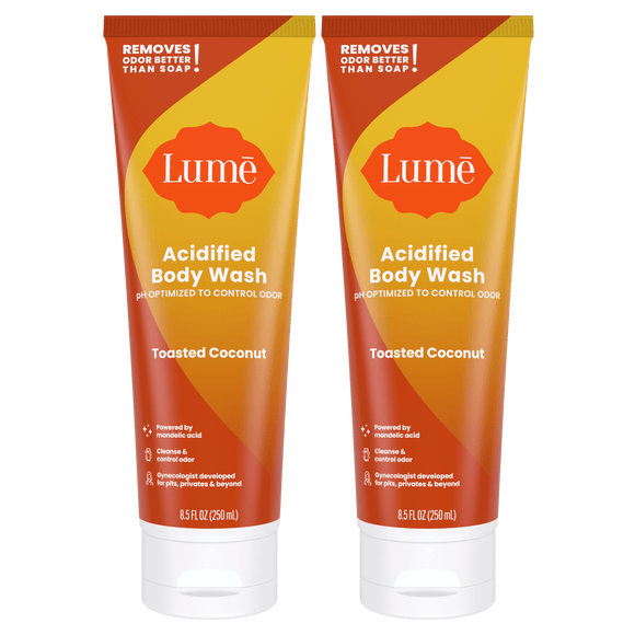 Two orange tubes of acidified body wash in the scent Toasted Coconut