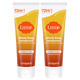Two orange tubes of cream deodorant in the scent Toasted Coconut