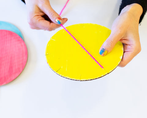 wrapping yarn around the cardboard shape