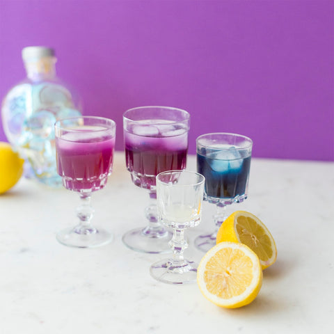 glasses filled with purple and blue butterfly pea tea