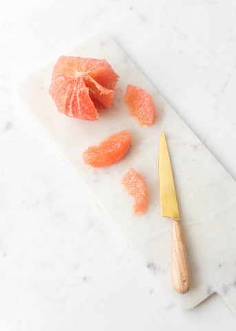 Peeled and sliced grapefruit wedges