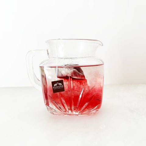 partially infused crimson berry tea in pitcher