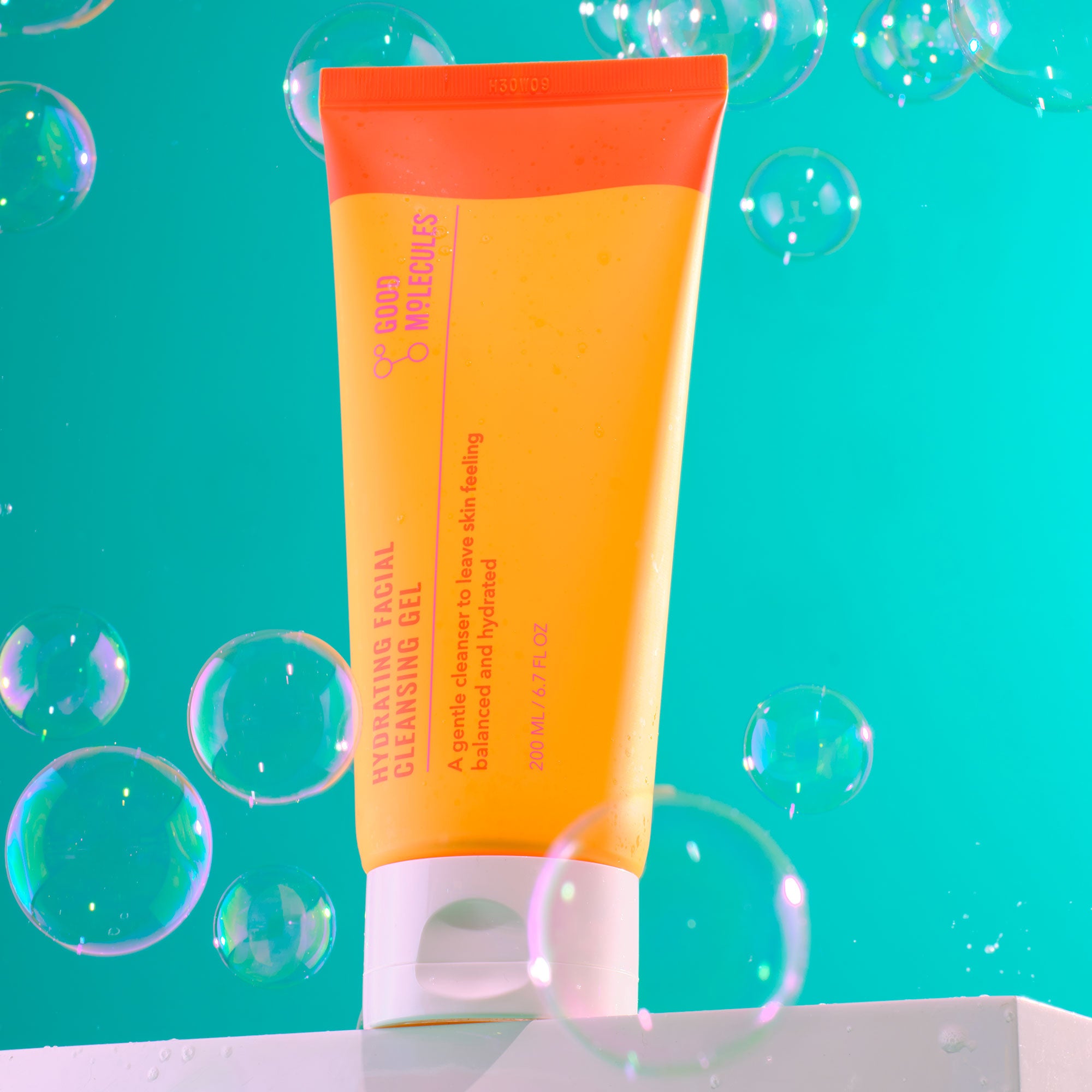 Hydrating Facial Cleansing Gel on teal background with bubbles