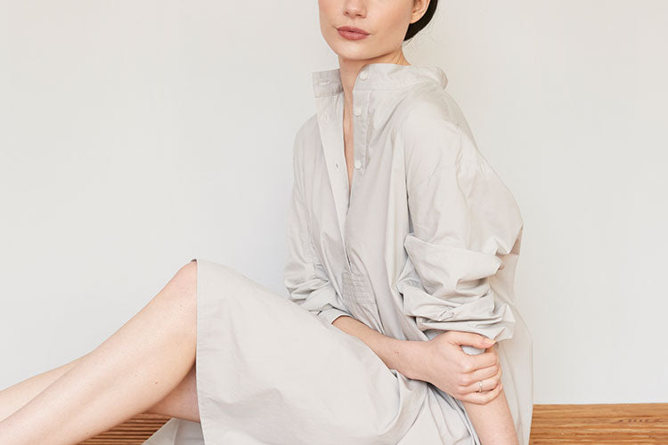 Woman in chic cotton luxury pajamas in light grey 