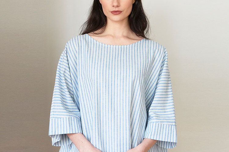 Woman in striped cotton linen kaftan with pockets 