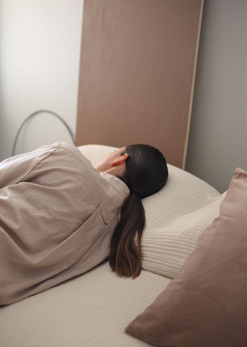 Girl lying down in Short Sleeve Cropped Sleep Shirt in Camel Twill