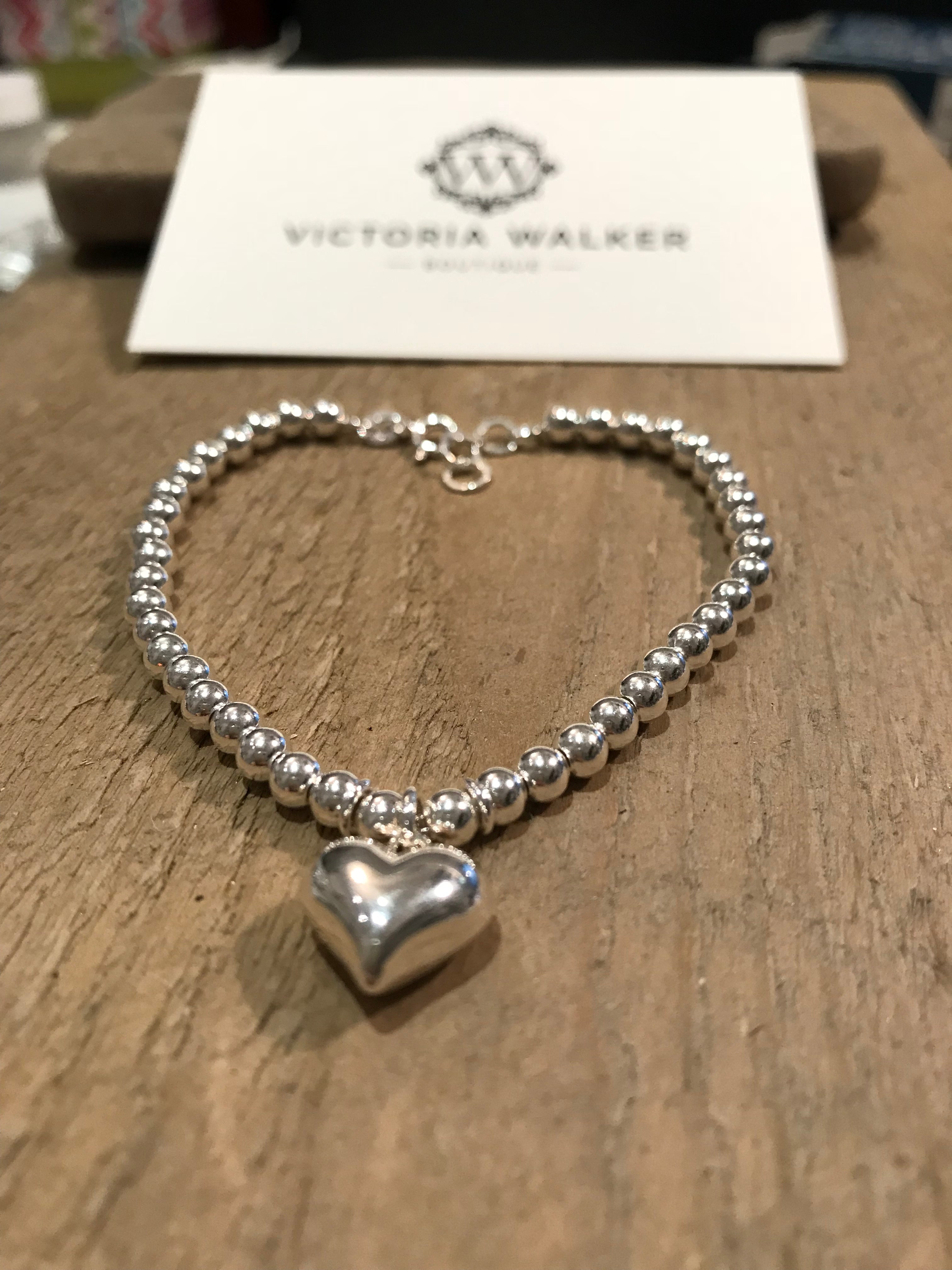 silver bead bracelet with heart charm