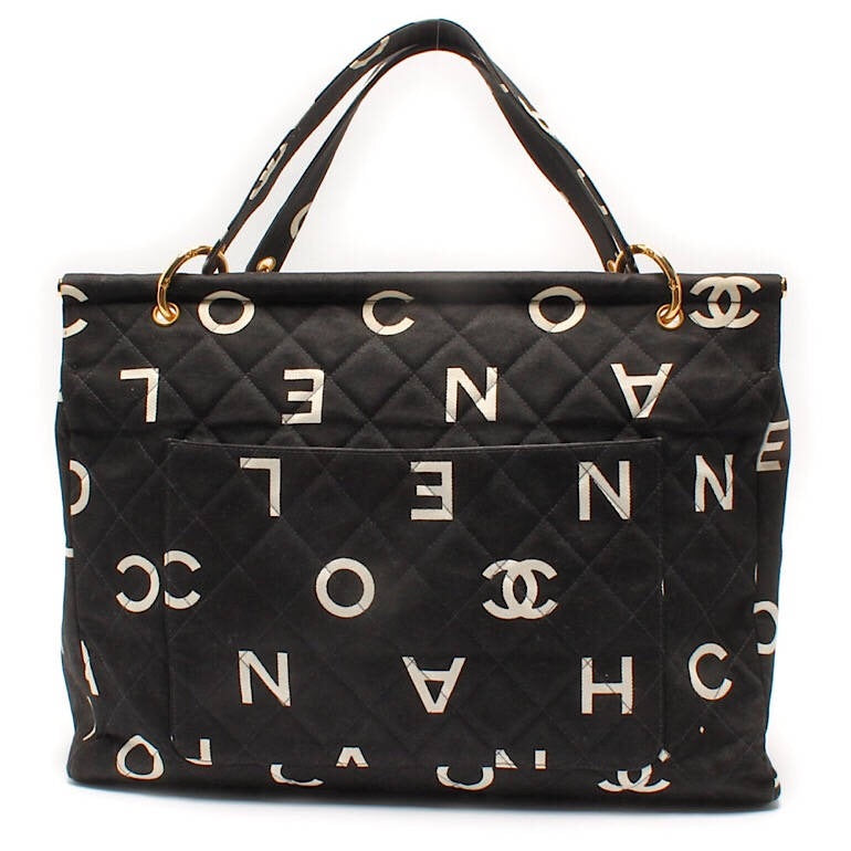 black chanel purse with white logo