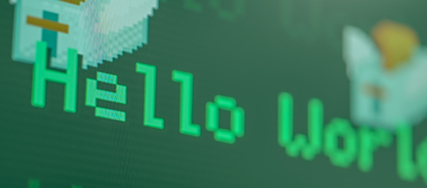 'Hello World' is displays in a bitmap font while toasters fly around it.