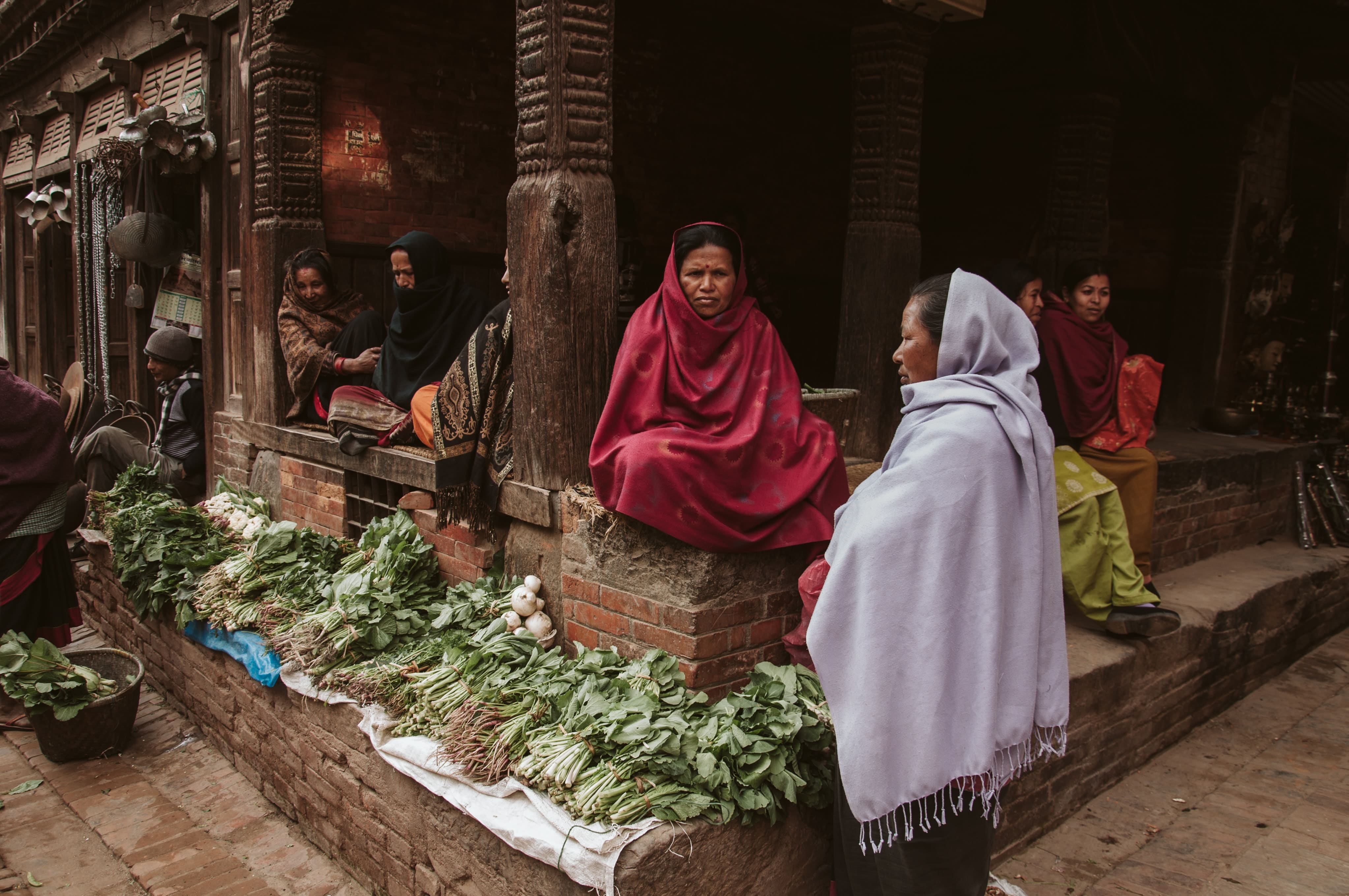 Women in red hijab at farmers' market in Bhaktapur, Nepal