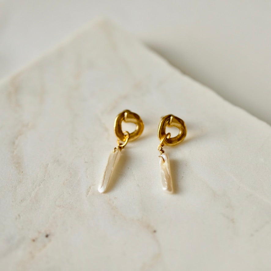 cycles with pearl drop earrings