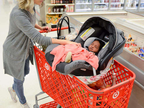 car seat on top of shopping cart