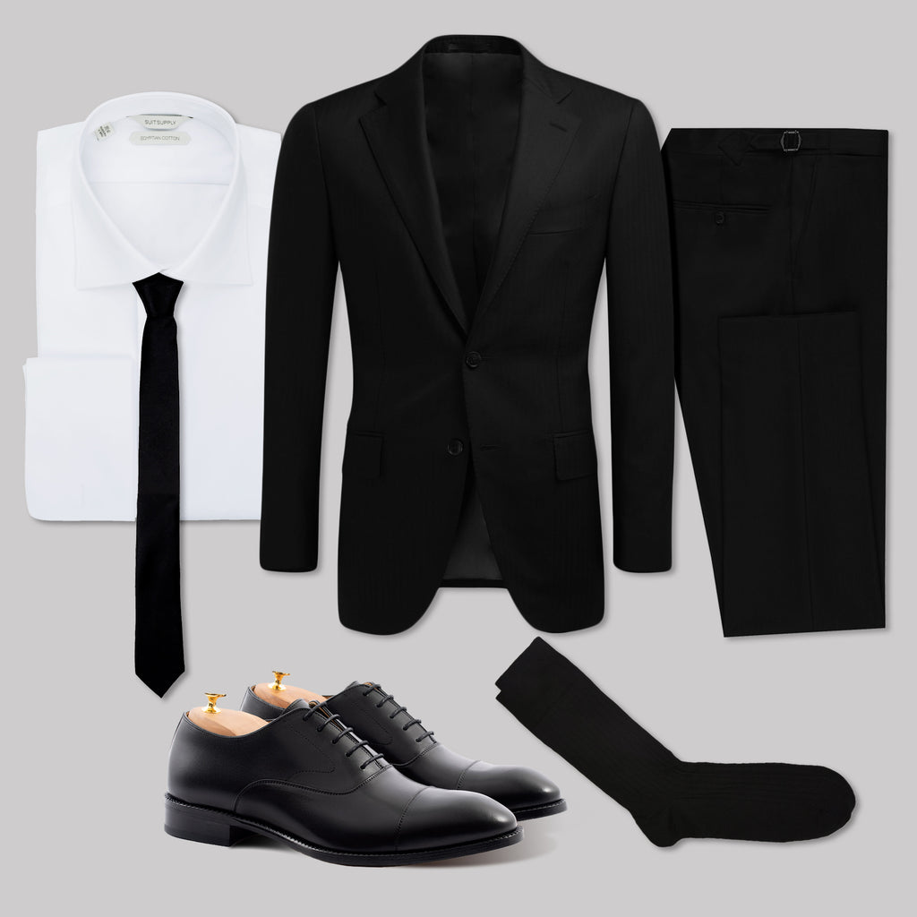 black suit white trainers