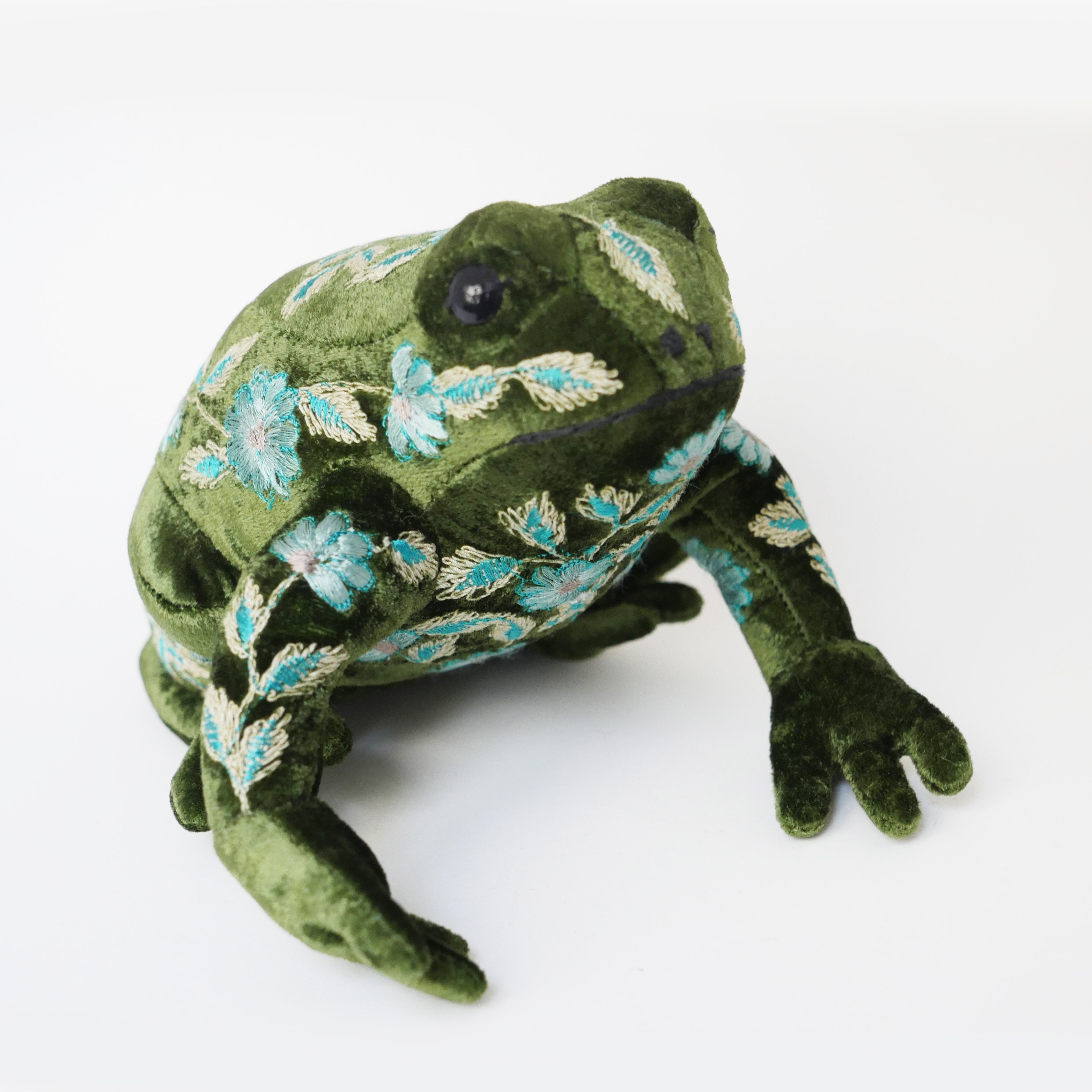 Green frog with blue flowers and leaves