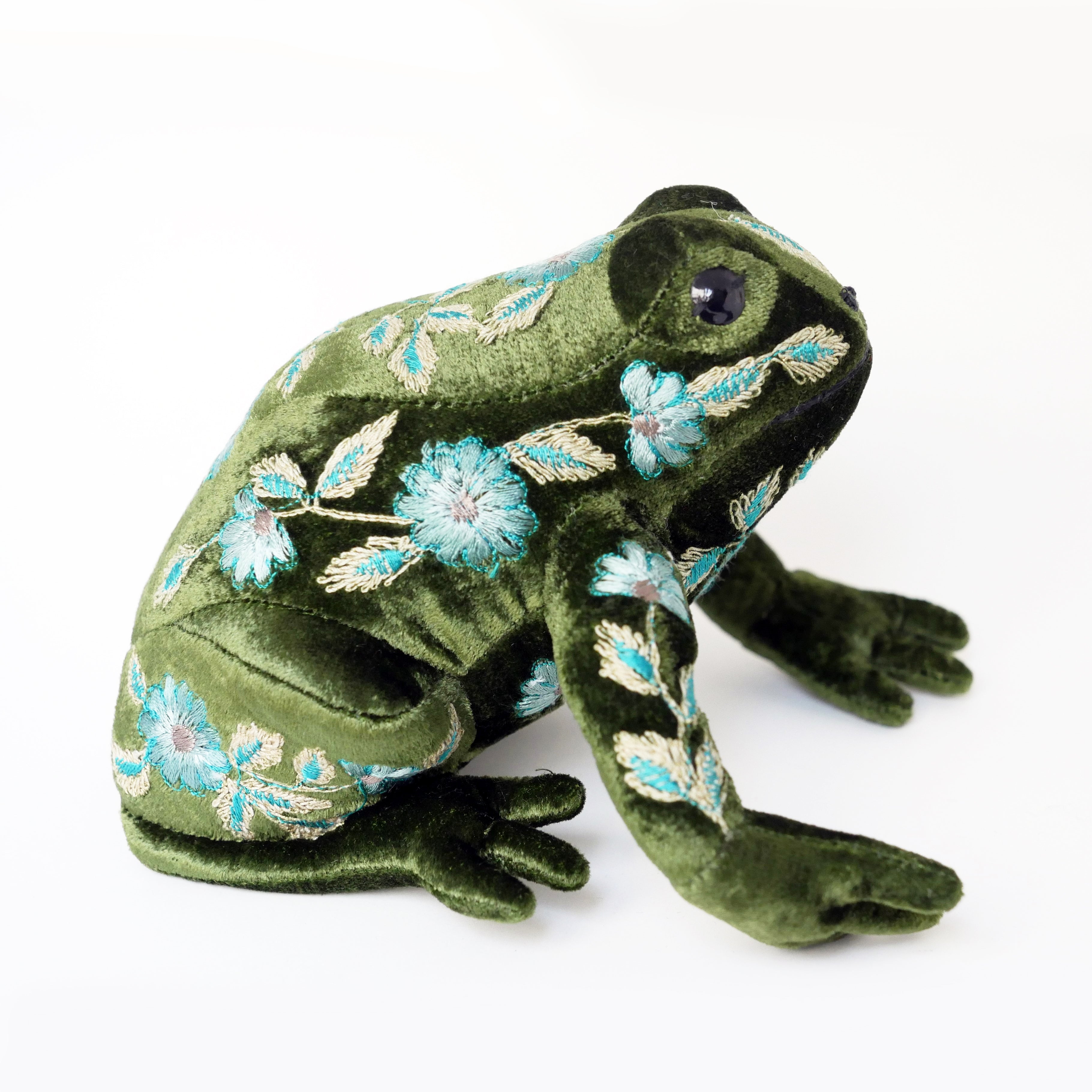 Green frog with blue flowers and leaves