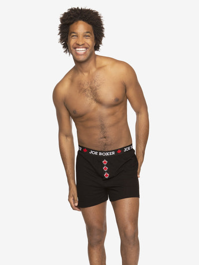 A young man wearing boxer shorts, knee … – Buy image – 11440954 ❘